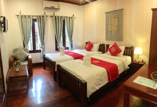 Luang Prabang Pangkham Lodge में एक कमरे में एक या कई बेड