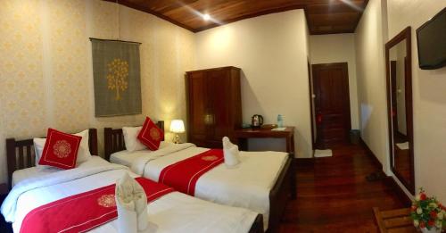 Luang Prabang Pangkham Lodge में एक कमरे में एक या कई बेड