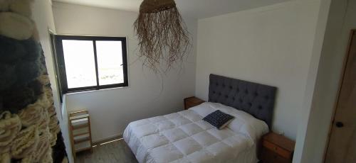 เตียงในห้องที่ Casa Puclaro, terraza panorámica Valle del Elqui