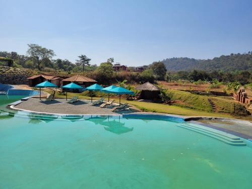 Poolen vid eller i närheten av The Dandelion - Colonels Jungle Resort