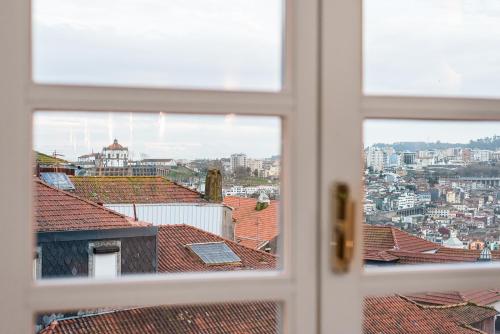 a view of a city from an open window at Door 65 - Historical Center Apartments in Porto