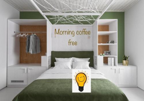 a bedroom with a bed with a light bulb on it at City Hotel Bortoli by Ribas in Odesa