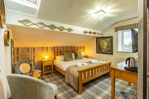 A bed or beds in a room at Holly Lodge Guest House with FREE off site health club