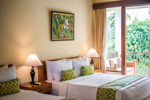 Cama ou camas em um quarto em Swahita Ubud