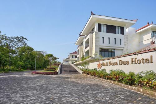 a street in front of a building at Bali Nusa Dua Hotel in Nusa Dua