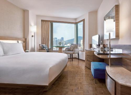 Cama ou camas em um quarto em Nina Hotel Causeway Bay