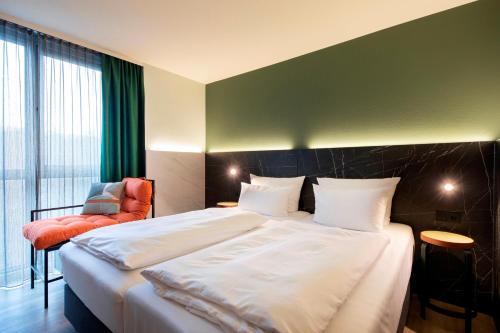 Giường trong phòng chung tại ACHAT Hotel Stuttgart Airport Messe