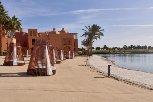 a resort with a row of infront of a body of water at Steigenberger Golf Resort El Gouna in Hurghada