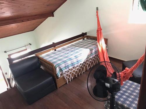 Una cama o camas en una habitación de Casa Duplex a 450m da Praia do Peró - Cabo Frio