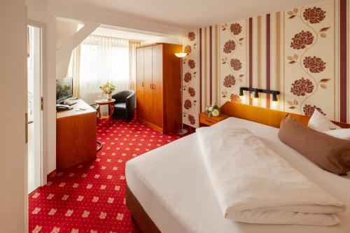 Giường trong phòng chung tại Hotel Berlin