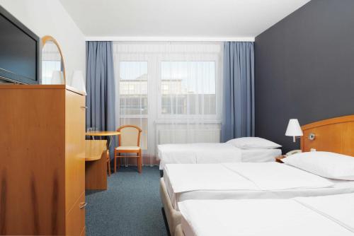 Krevet ili kreveti u jedinici u objektu OREA Hotel Voro Brno