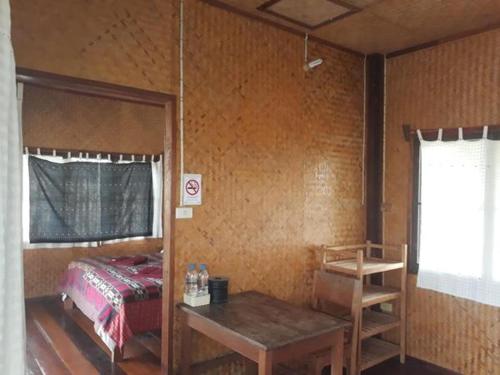 A bed or beds in a room at Bueng Pai Farm บึงปายฟาร์ม