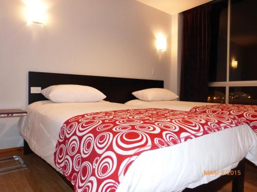 Cama ou camas em um quarto em Hotel San Marcos