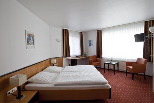 Cama ou camas em um quarto em Hotel Am Braunen Hirsch