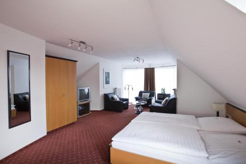 Cama ou camas em um quarto em Hotel Am Braunen Hirsch