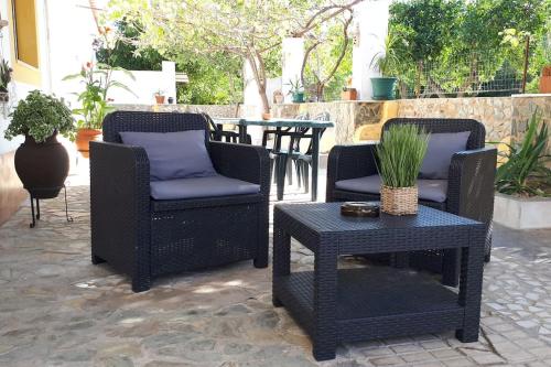 a group of chairs and a table on a patio at Quinta da Ponte das Hortas 1 in Elvas