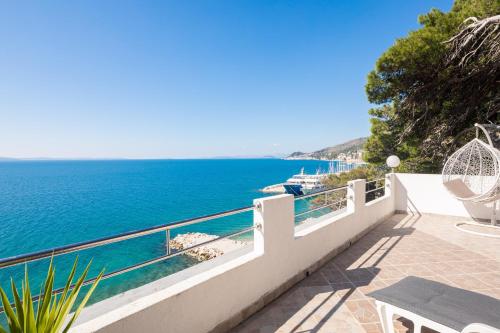 a balcony with a view of the ocean at Sky Way Apartments in Dugi Rat