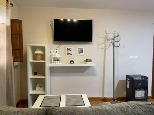 TV i/ili multimedijalni sistem u objektu Habitación con encanto