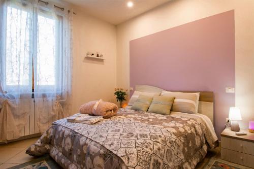 Llit o llits en una habitació de B&B Le Rose di Gori Cristina