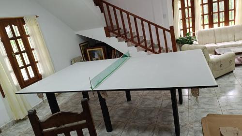 a white table in a living room with chairs at La Viajera in San Lorenzo