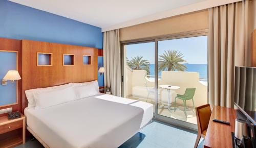 Cama ou camas em um quarto em Sercotel Kalma Sitges