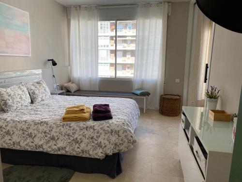 Gulta vai gultas numurā naktsmītnē Precioso y tranquilo apartamento zona alta Diagonal Barcelona