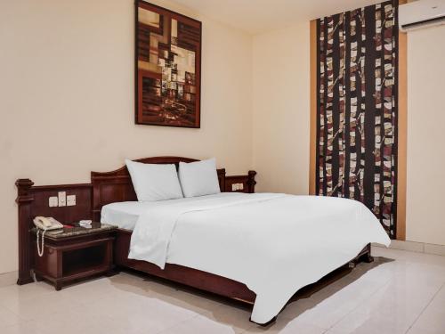 A bed or beds in a room at Townhouse OAK Bi Executive