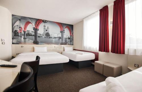 Krevet ili kreveti u jedinici u objektu B&B HOTEL Krakow Centrum