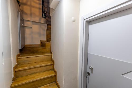 a staircase in a house with wooden floors at Calanthe Residence in Istanbul