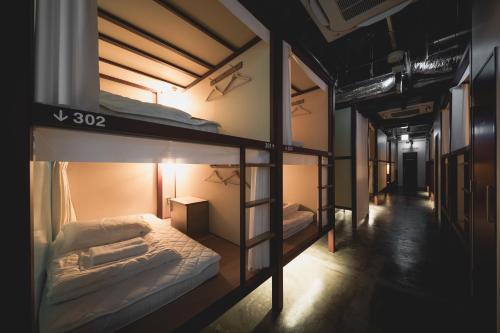 Una cama o camas en una habitación de HELIO HOSTEL SAPPORO