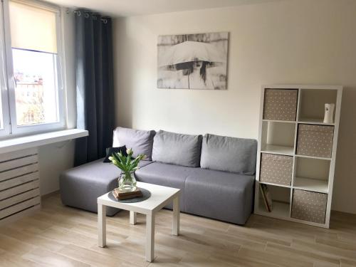 Uma área de estar em Uroczy apartament w Giżycku