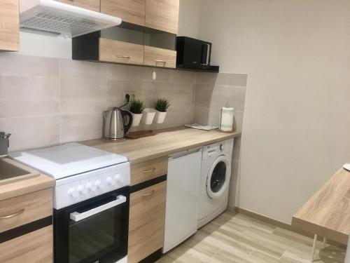 A cozinha ou cozinha compacta de Uroczy apartament w Giżycku