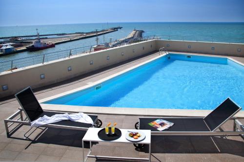 a swimming pool on the roof of a cruise ship at Hotel Tiber in Fiumicino