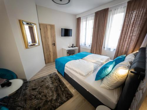 Posteľ alebo postele v izbe v ubytovaní Boutique Apartments Old Town