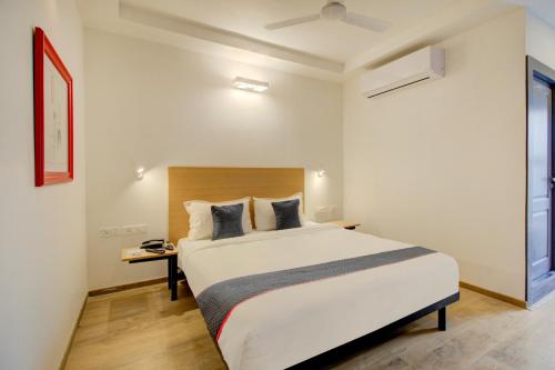 Postelja oz. postelje v sobi nastanitve Super Townhouse - Q Rooms BTM Layout Near Gopalan Innovation Mall