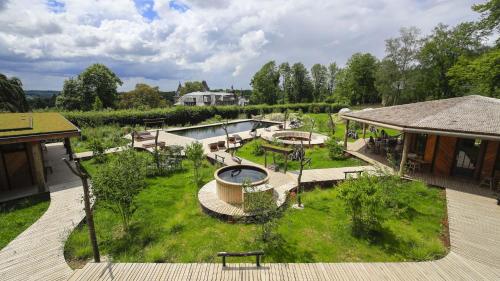 an aerial view of a garden with a fire pit at Domaine de Ronchinne - Maison du Jardinier in Maillen