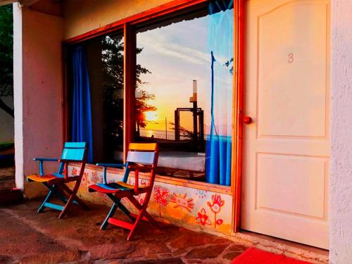 A balcony or terrace at Playa del Ritmo Beach Hostel & Bar - Adults Only