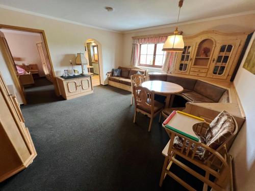 a living room with a couch and a table at Hotel Sonnekalb in Naumburg