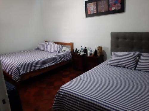 Cama ou camas em um quarto em Atacama Hostel Backpackers