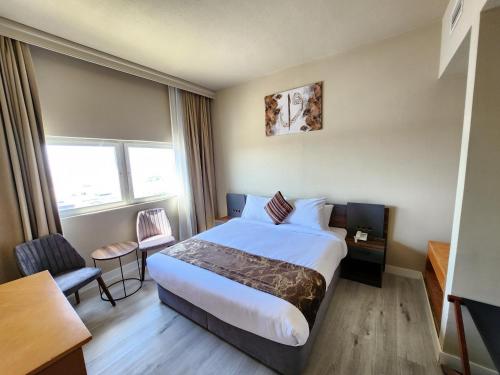 Кровать или кровати в номере The Saj Hotel