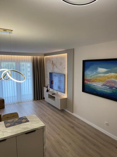 A television and/or entertainment centre at Moris Boutique Beach Hotel