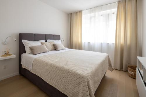 Postelja oz. postelje v sobi nastanitve Apartment Nova 4*