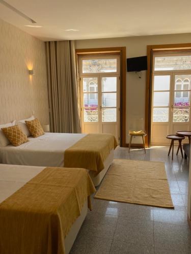 Cama ou camas em um quarto em Enjoy Viana - Guest House