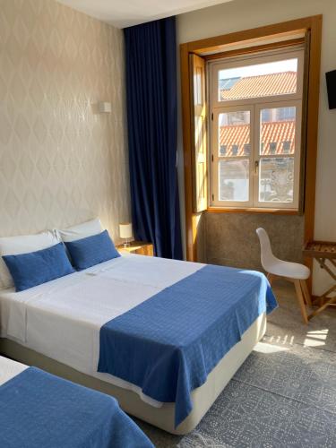 Cama ou camas em um quarto em Enjoy Viana - Guest House