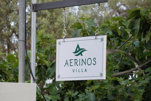 a sign that reads interns villa hanging from a tree at Aerinos private villa in Lefkada Town