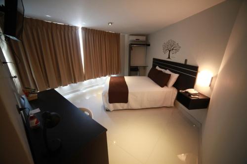 Tempat tidur dalam kamar di Suche Park Hotel