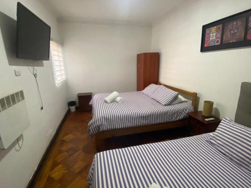 Cama ou camas em um quarto em Atacama Hostel Backpackers