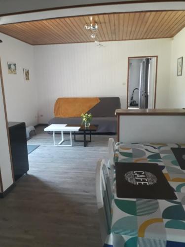 a living room with a couch and a table at MADALNY HOUSE in La Garnache