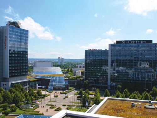 a view of a city with tall buildings at DORMERO Hotel Stuttgart in Stuttgart