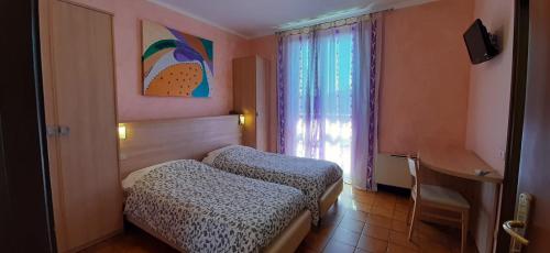 Krevet ili kreveti u jedinici u okviru objekta Hotel Chiara